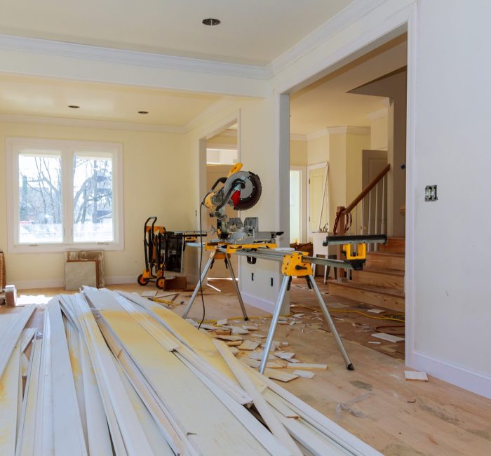 Circular saw cutting wooden trim on with on remodeling home